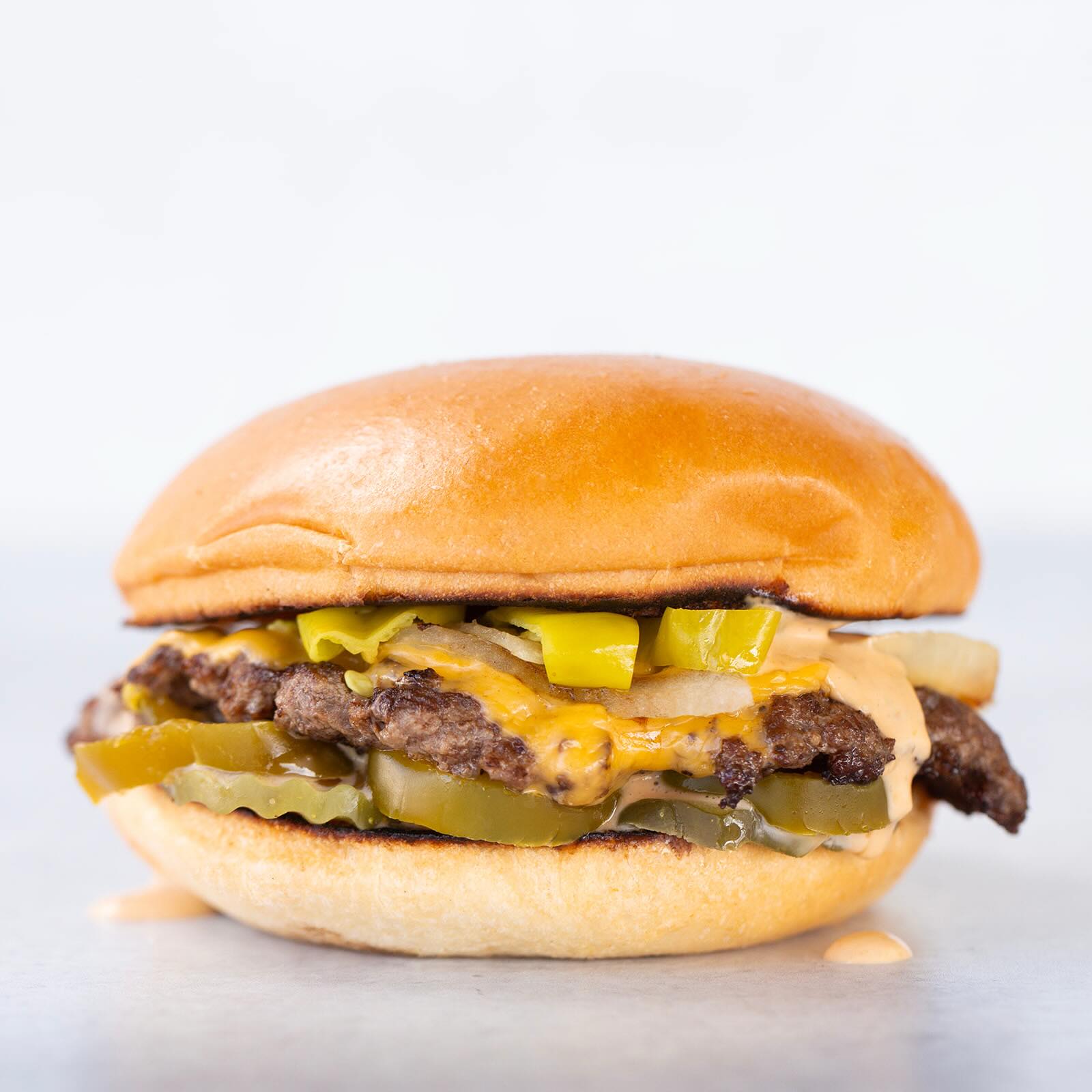 Provo Burger with pickles and onions